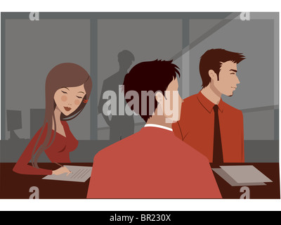 Three people in red clothing at a business meeting Stock Photo