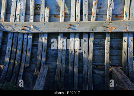 old boat hull wreck wooden and worn boat hull background on beach Stock ...