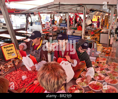 Bergen seafood market, Norway Customers buying fresh produce from stalls Stock Photo