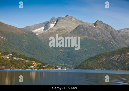 Norwegian fjord landscape view, cruising West from Olden, Norway. Late afternoon warm sunlight Stock Photo