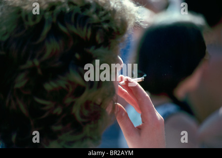 Smoking Marijuana Joint, Smoker using Cannabis Drugs, Dope Pot Addiction Stock Photo