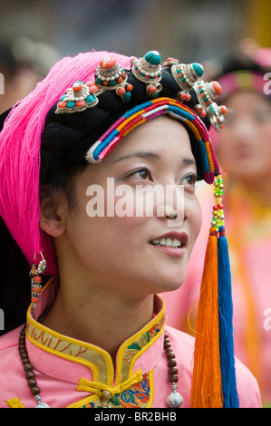 Ethnic Tibetan performer wears traditional costume at dance and folk festival, Danba, Sichuan Province, China Stock Photo