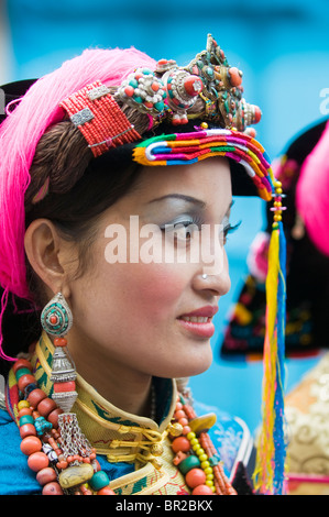 Ethnic Tibetan performer wears traditional costume at dance and folk festival, Danba, Sichuan Province, China Stock Photo