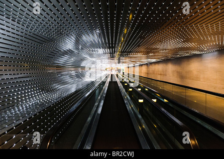 National Gallery Of Art Multiverse Light Sculpture Washington DC | WASHINGTON D.C., United States — Radiating bands of LEDs converge toward a vanishing point in "Multiverse," Leo Villareal's light installation lining the underground Concourse of the National Gallery of Art. The 2008 piece runs about 200 feet (61 m) between the museum's East and West Buildings, its roughly 41,000 lights cycling through programmed sequences layered with randomness. Stock Photo