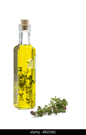 Thyme infused olive oil over white background Stock Photo