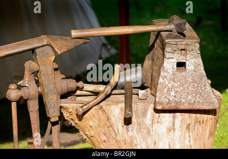 The tools of a blacksmith. Anvil and hammers Stock Photo