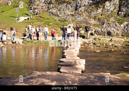 People on a bank holiday, Stepping stones, Dovedale, Derbyshire, Peak District National Park, England, UK Stock Photo