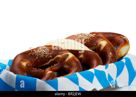 some pretzels in a bavarian bread basket on white background Stock Photo