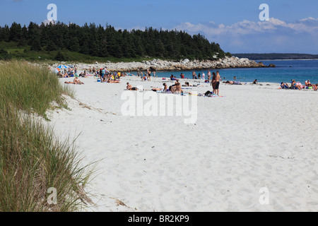 people relaxing on the sandy beach of Crystal Crescent Beach, Halifax, Nova Scotia, Canada. Photo by Willy Matheisl Stock Photo
