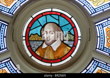 Stained Glass window with William Shakespeare in the centre Stock Photo