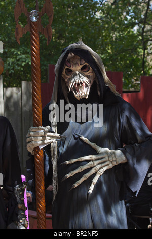 Halloween and costume scary ghost skull mask in USA  funny monster skeleton funny dress in public street hi-res Stock Photo