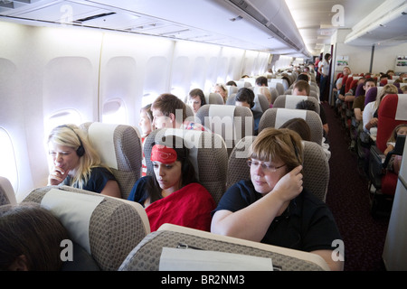 passengers flying in a Virgin Atlantic Boeing 747 from Gatwick to Las Vegas Stock Photo