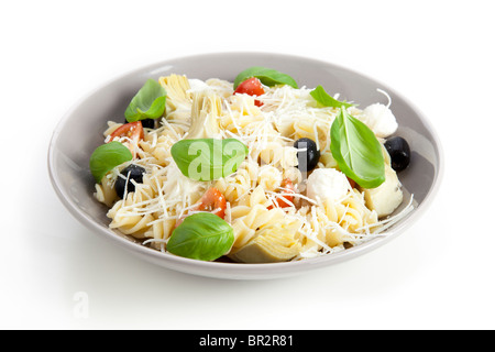 Bowl of pasta salad on white background. Stock Photo