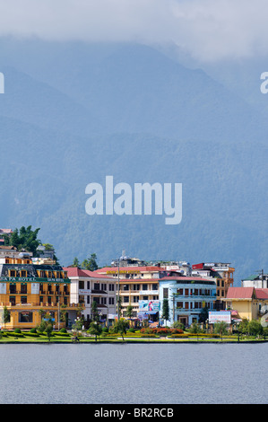 View of the lake in Sapa, Vietnam, with the city and mountains in the background. Stock Photo
