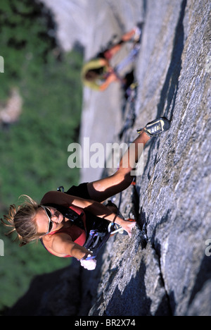 Woman lead climbing on a big wall (high angle perspective). Stock Photo