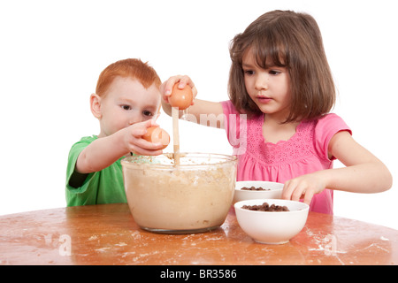 Kids baking chocolate chip cookies. Isolated on white. Stock Photo