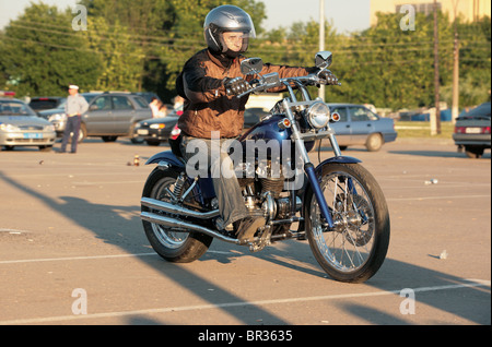 Biker riding a chopper on one wheel isolated on white background Stock ...
