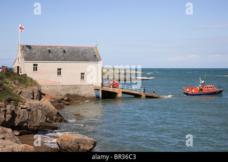 Moelfre, Isle of Anglesey, North Wales, UK, Britain. Lifeboat returning to the lifeboat station Stock Photo