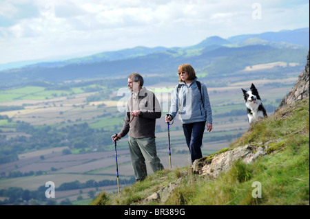 Mature couple walking on the Wrekin Hill in Shropshire Stock Photo - Alamy