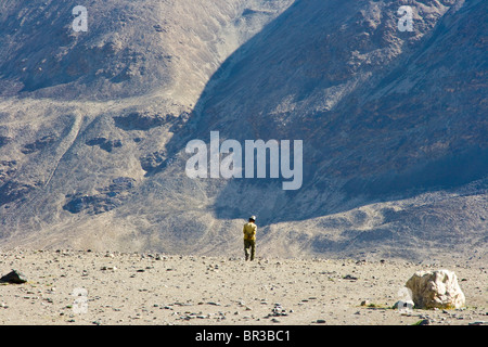 Local Man Walking Alone near Jalang Village the Pamirs in Tajikistan Stock Photo