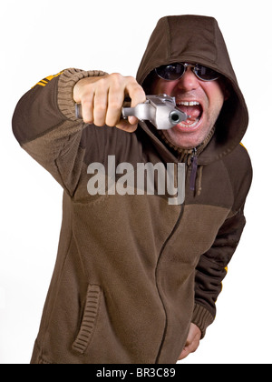 man in a hood with gun Stock Photo