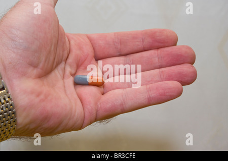 Mans Open Hand Holding A Flucloxacillin Capsule Antibiotic Capsule Stock Photo