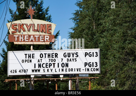 Billboard advertising the current movie playing at the old-fashioned drive-in movie theater in Shelton, Washington. Stock Photo