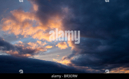 Colorful evening clouds at sky at sunset Stock Photo