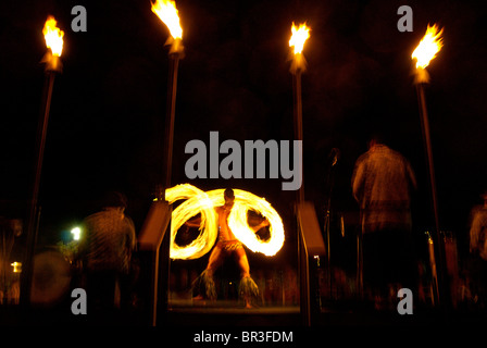 A man performs at a luau on the island of Maui, Hawaii. (motion blur). Stock Photo