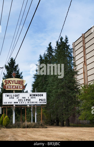 Billboard advertising the current movie playing at the old-fashioned drive-in movie theater in Shelton, Washington. Stock Photo