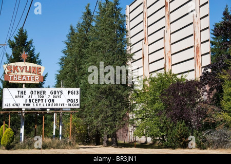 Billboard advertising the current movie playing at the old-fashioned drive-in movie theater in Shelton, Washington. Stock Photo