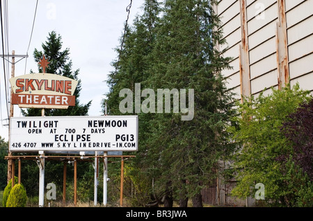 Billboard advertising the current movie playing at the old-fashioned drive-in movie theater in Shelton, Washington. Stock Photo