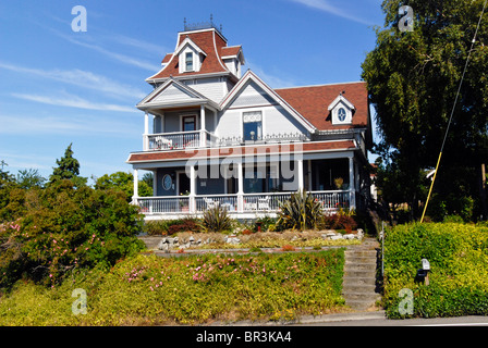 historic Victorian house with mansard gable & decorative widows walk in Port Townsend Olympic Peninsula Jefferson County  WA Stock Photo