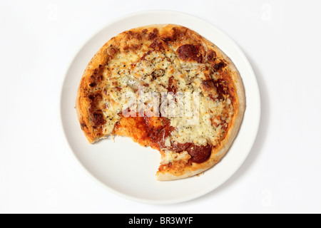 Partly eaten Pepperoni Pizza on a white background Stock Photo