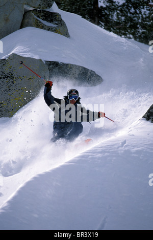 Skier making fresh tracks in deep powder Stock Photo - Alamy