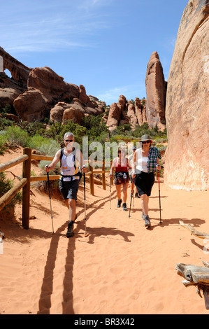 Hikers in Devil's Garden Area Arches National Park Moab Utah Stock Photo