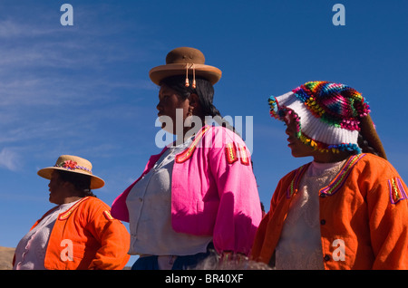 Ladies wearing traditional costume at Lake Titicaca in Peru Stock Photo