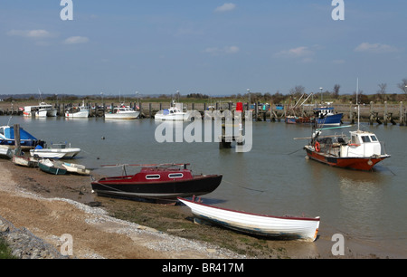 Fishing boats and pleasure craft moored in the tidal harbour at Rye, East Sussex Stock Photo