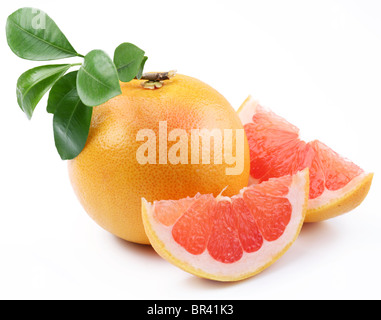 Ripe grapefruit with leaves and slices on white background Stock Photo