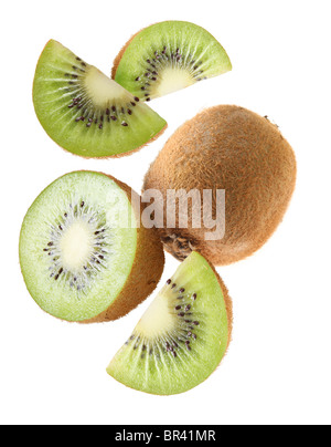 Falling kiwi fruit and kiwi slices. Isolated on a white background. Stock Photo