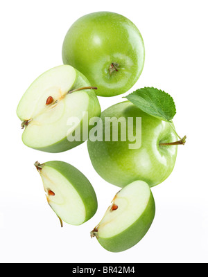 Falling apple and apple pieces Stock Photo