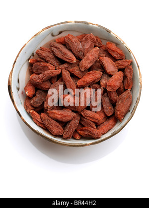 A bowl of goji berries on a white background Stock Photo