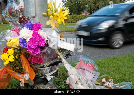 Roadside floral tributes on the busy A560, Altrincham Rd,Brooklands,Manchester. Stock Photo