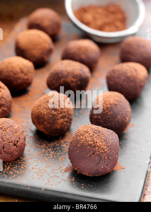 Chocolate truffles dusted with cocoa powder Stock Photo