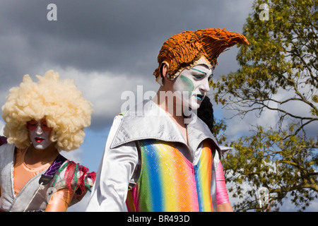 Men on stilts dressed as Rockers Stock Photo