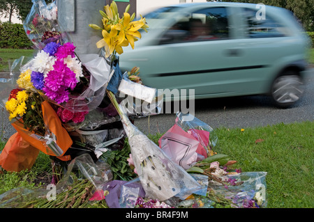 Roadside floral tributes on the busy A560, Altrincham Rd,Brooklands,Manchester. Stock Photo