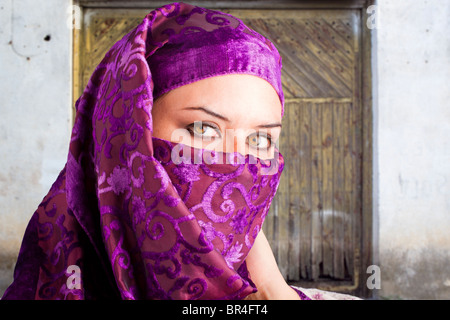 woman dressed in saharaui costume, old street background Stock Photo