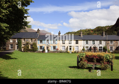 Row of traditional terraced cottages around the village green in Beddgelert, Gwynedd, North Wales, UK. Stock Photo