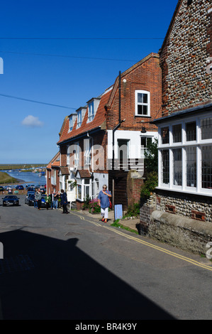 The High Street in Blakeney, Norfolk, looking towards the coast and salt marshes Stock Photo