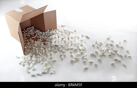 packing peanuts spill from cardboard box Stock Photo